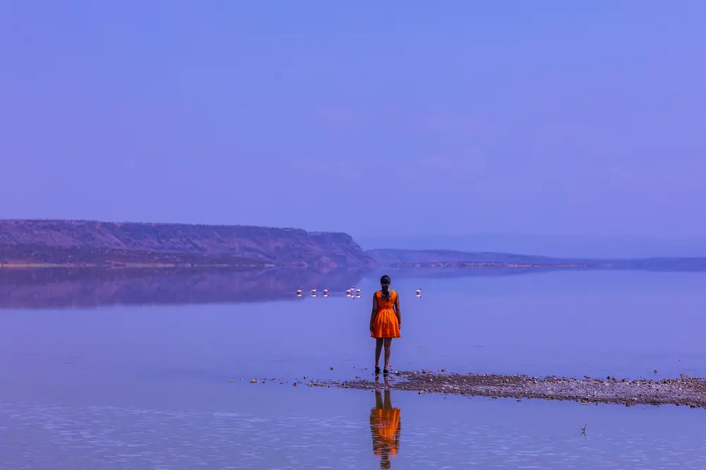 Young woman standing in lake