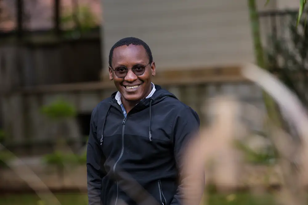 Man smiling at kenyan park