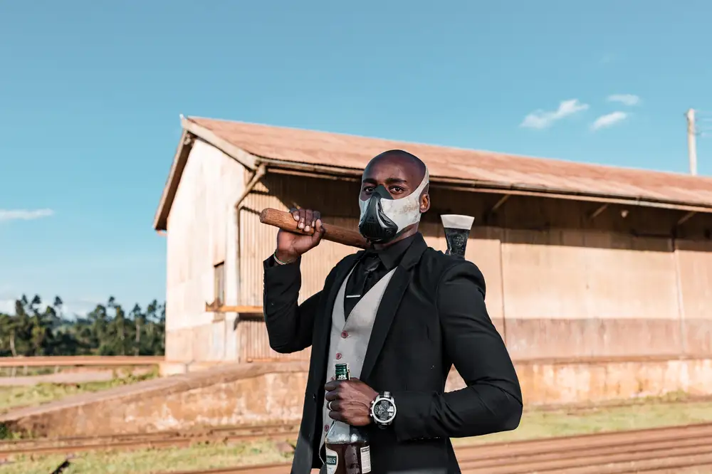 Masked Man on suit holding axe