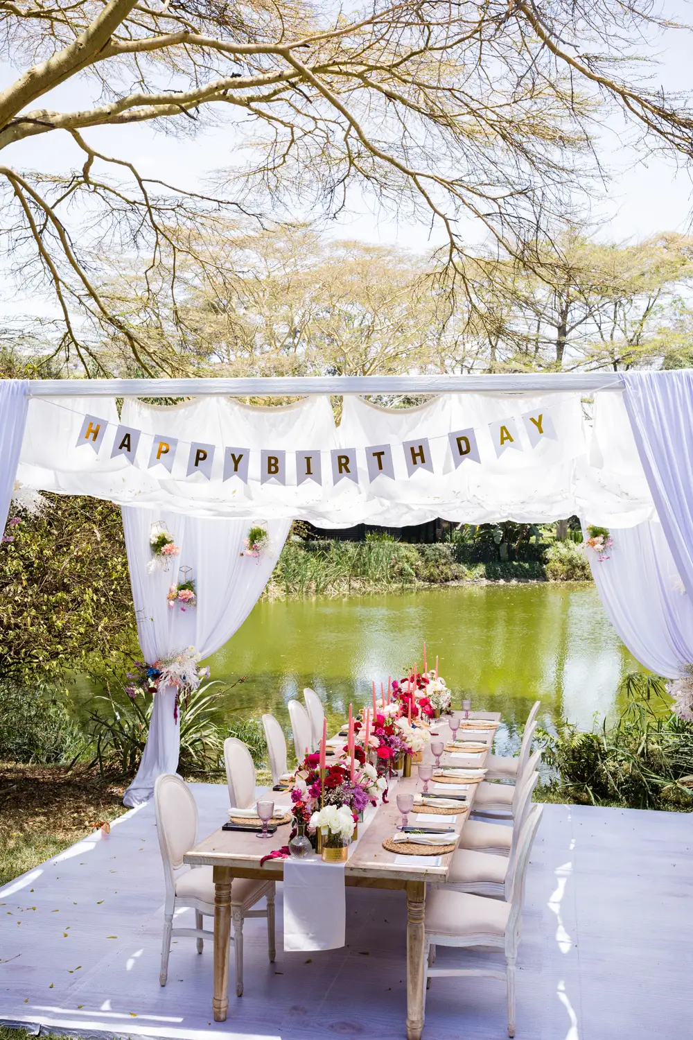 White themed birthday party by a river