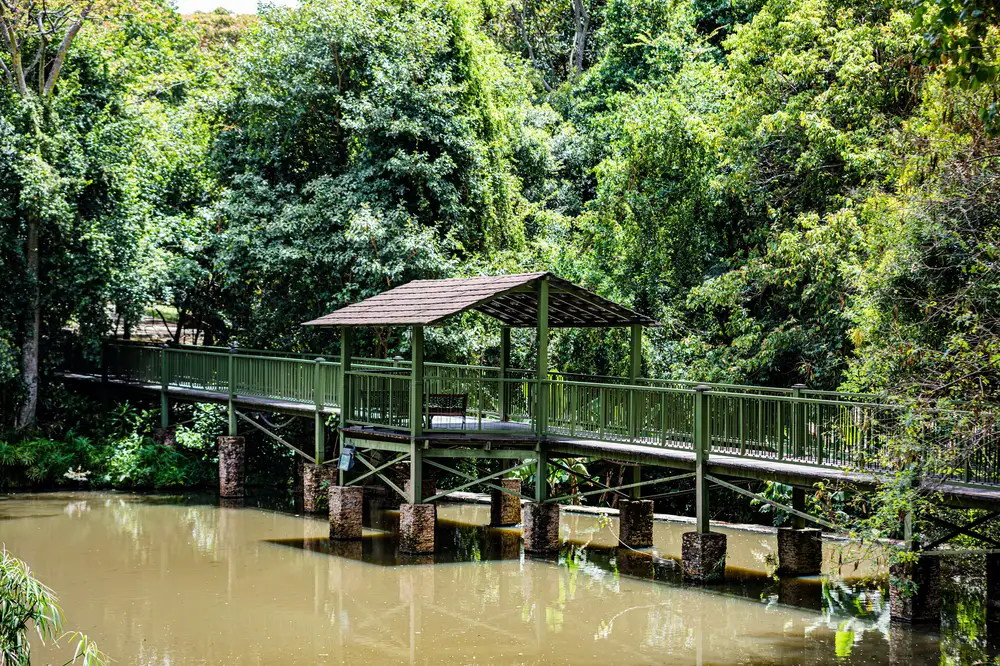 Bridge with a small shade spanning across a river