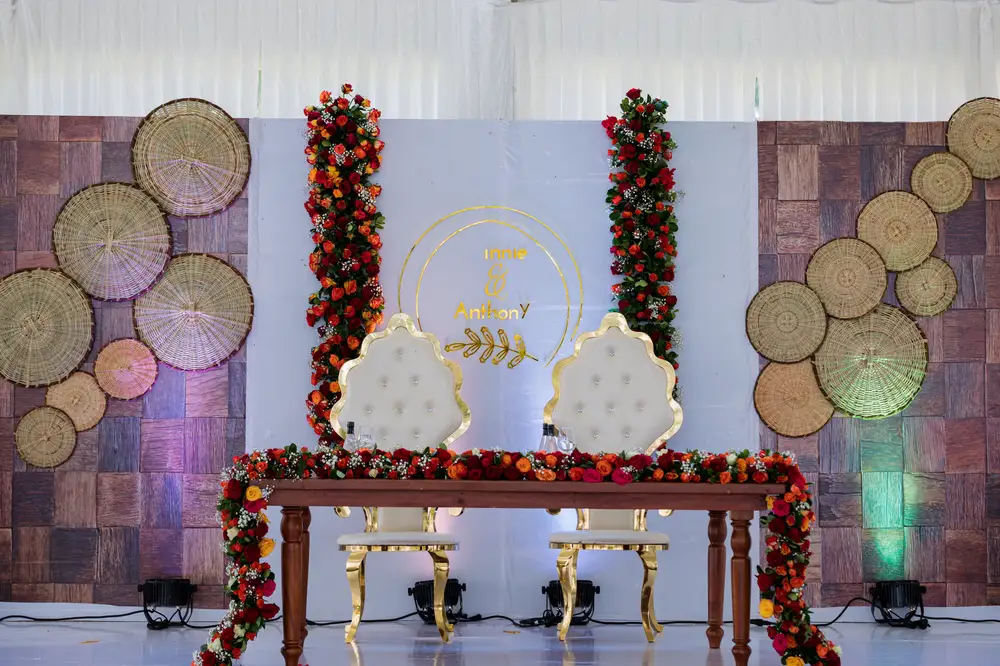 Couples Wedding chair on a stage decorated with flowers