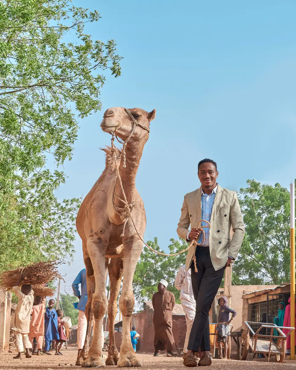 Man holding a camel