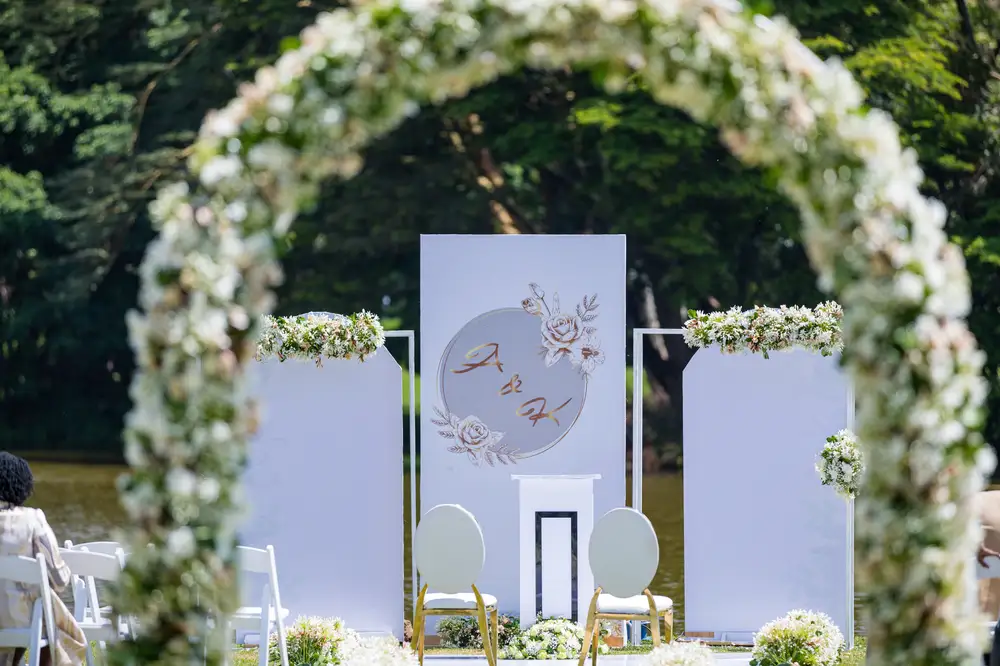 White themed wedding with flower arc