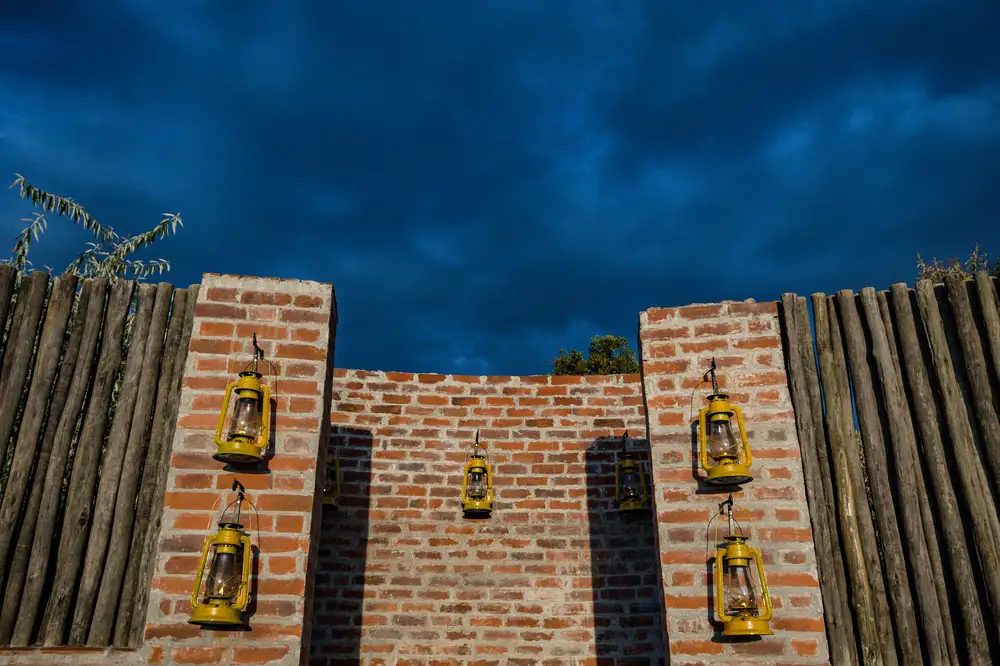 Brick wall decorated with vintage lanterns