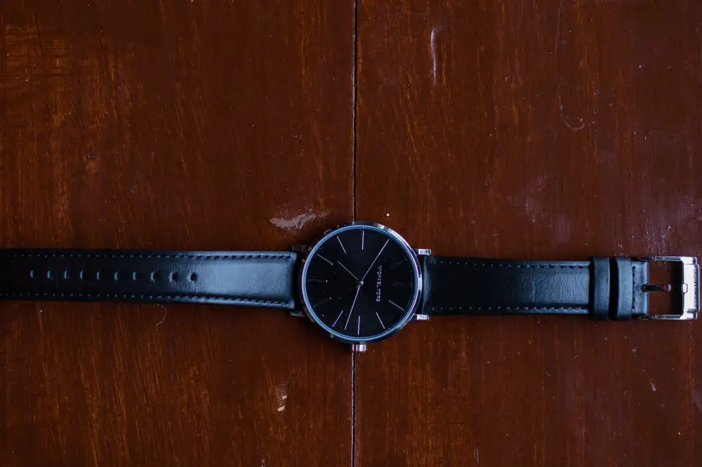 Wrist watch with a black leather strap