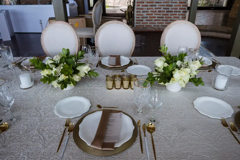 White themed Dinning table set Decorated with flowers