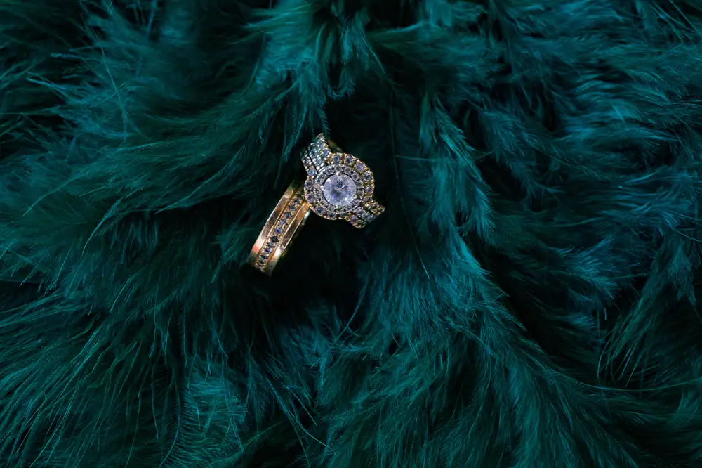 Diamond rings on Green peacock feather