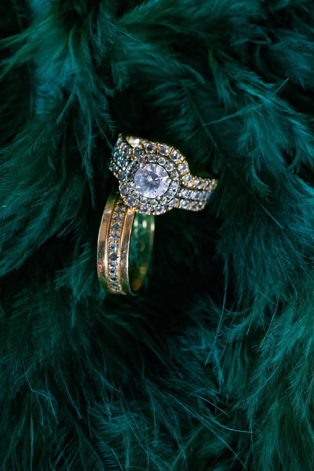 Diamond Wedding rings  on a green furry surface