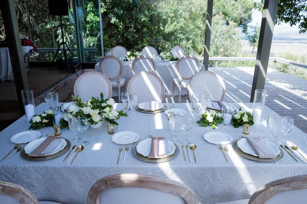 White table with dishes setup for a wedding