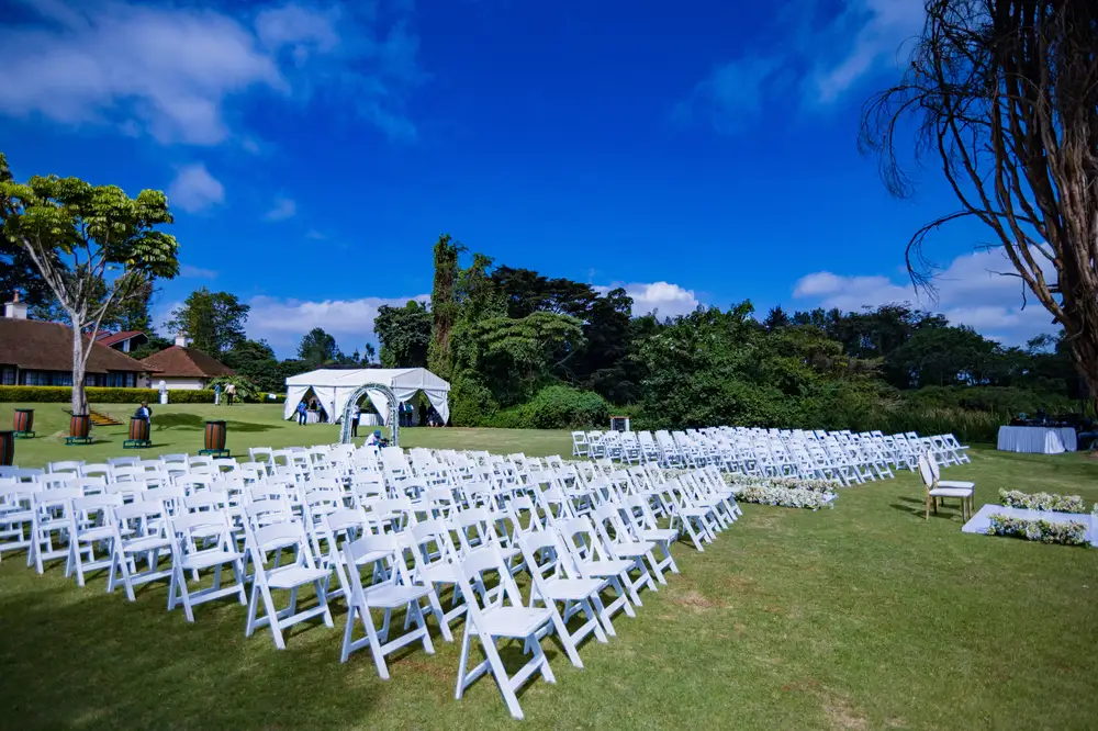 White chairs setup for outdoor wedding