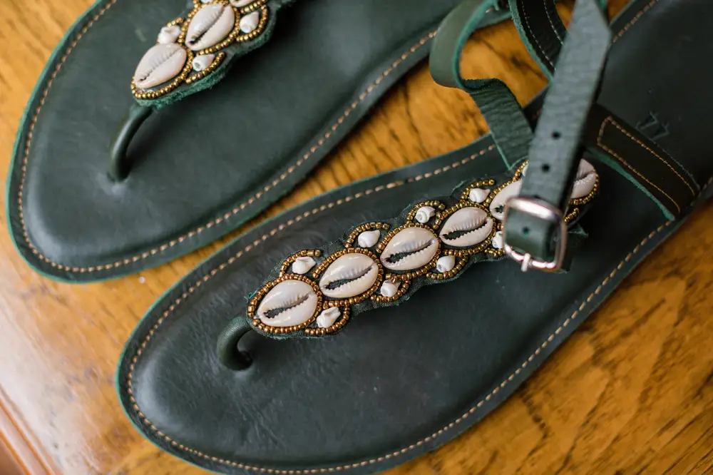 Black leather sandals Decorated with cowries for Men