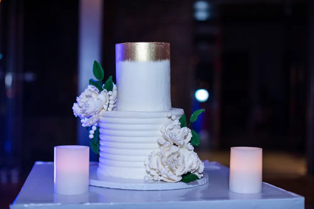 White wedding cake with scented candle