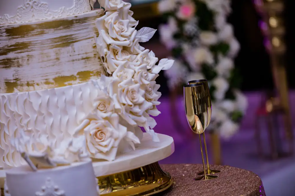 Elegant White wedding Cake with Golden cutlery