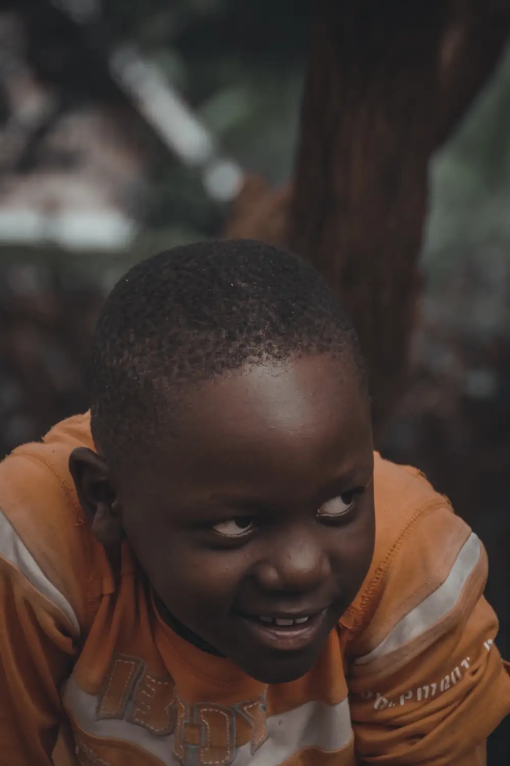 Boy smiling and looking sideways