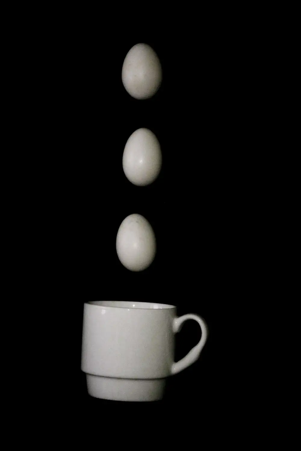 Dropping eggs in a cup