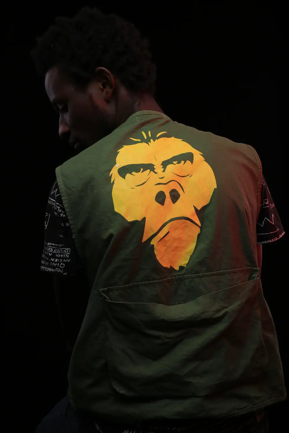 Man wearing a jacket with ape design