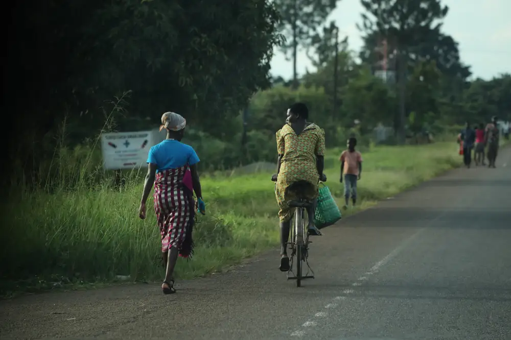 Two women having a conversation on the road