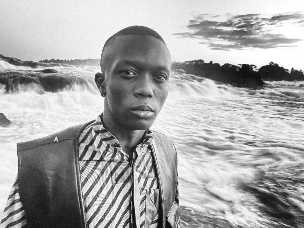 Black man in front of a river