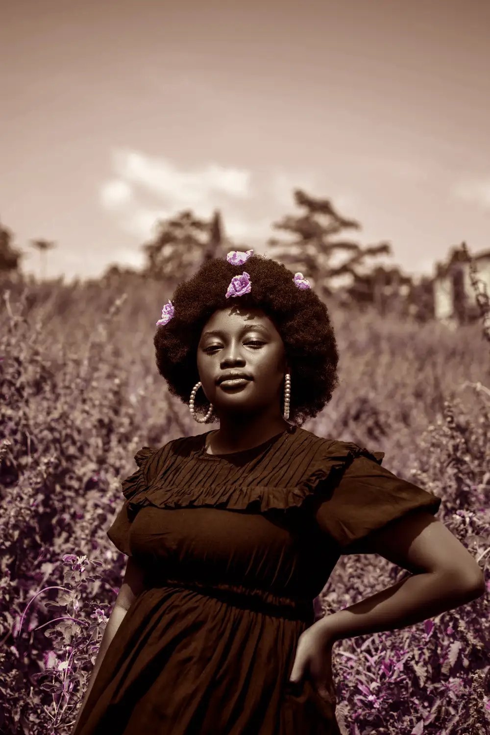 Lady with flowers in afro hair