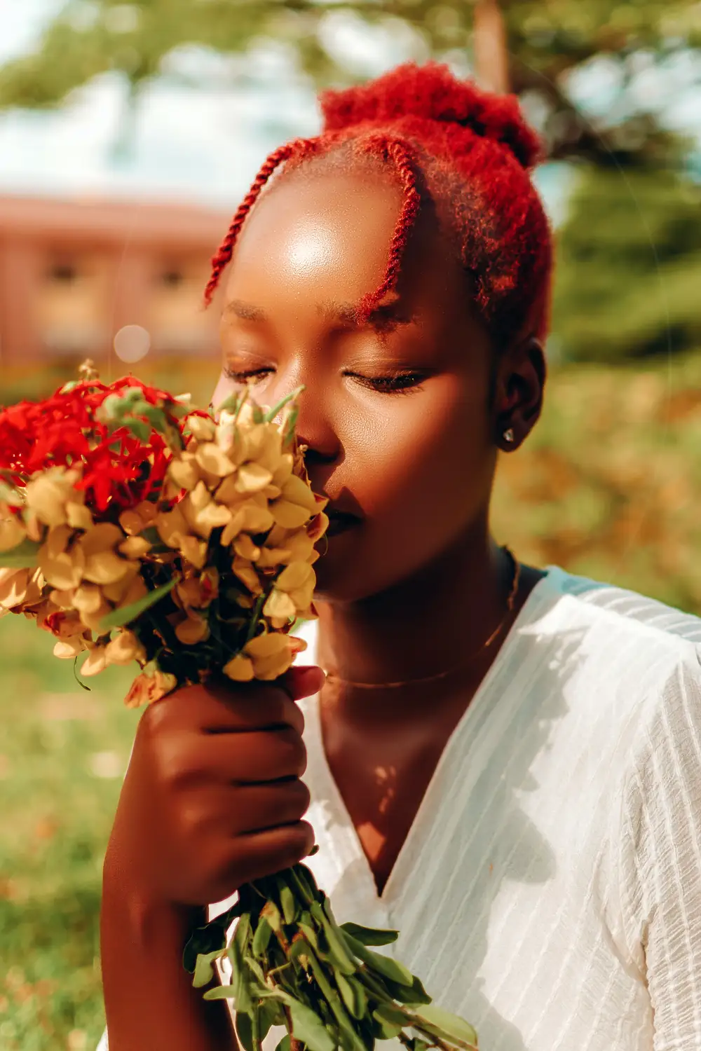 Lady smelling nice flowers