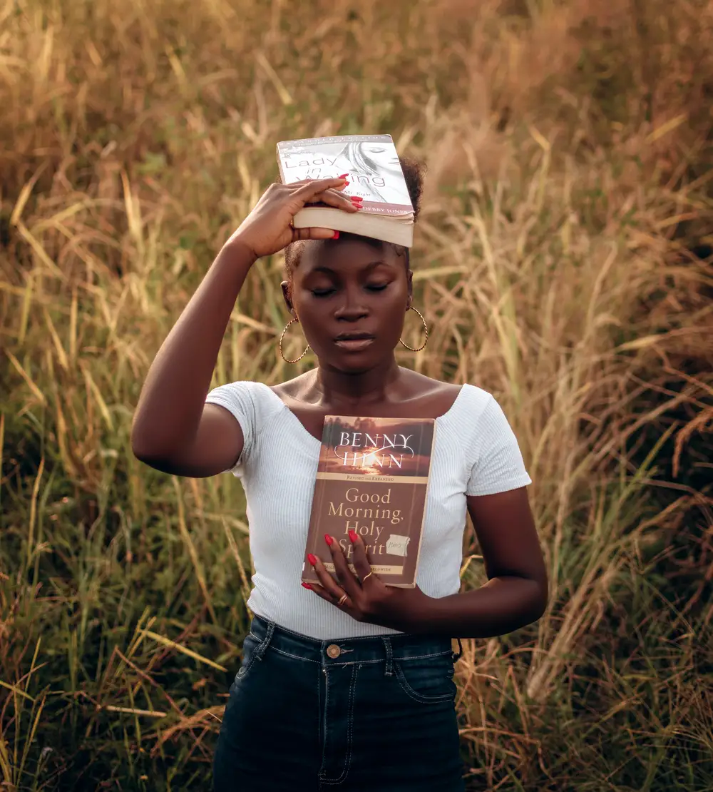 Lady carrying christian devotionals