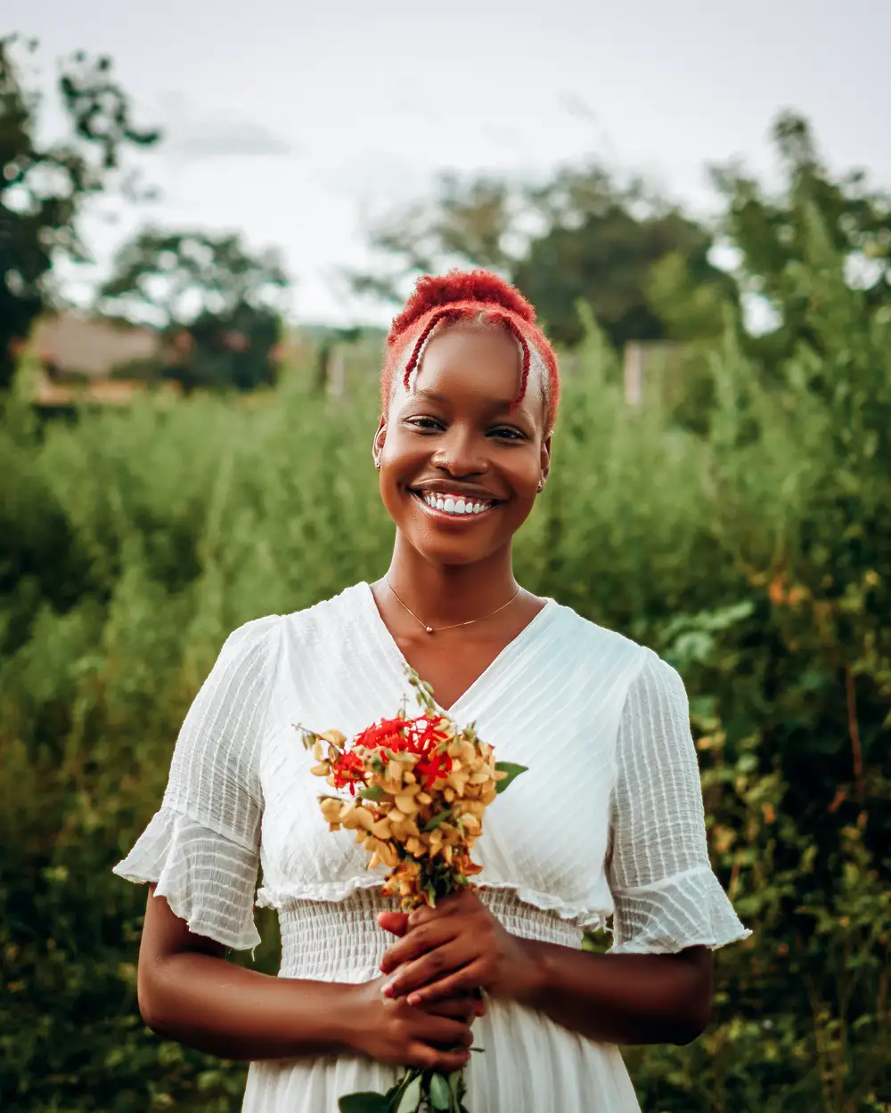 Lady smiling holding flowers