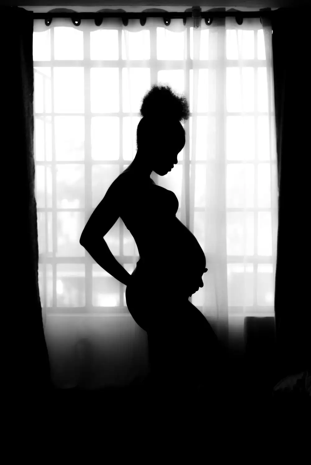 Silhouette of pregnant woman photo