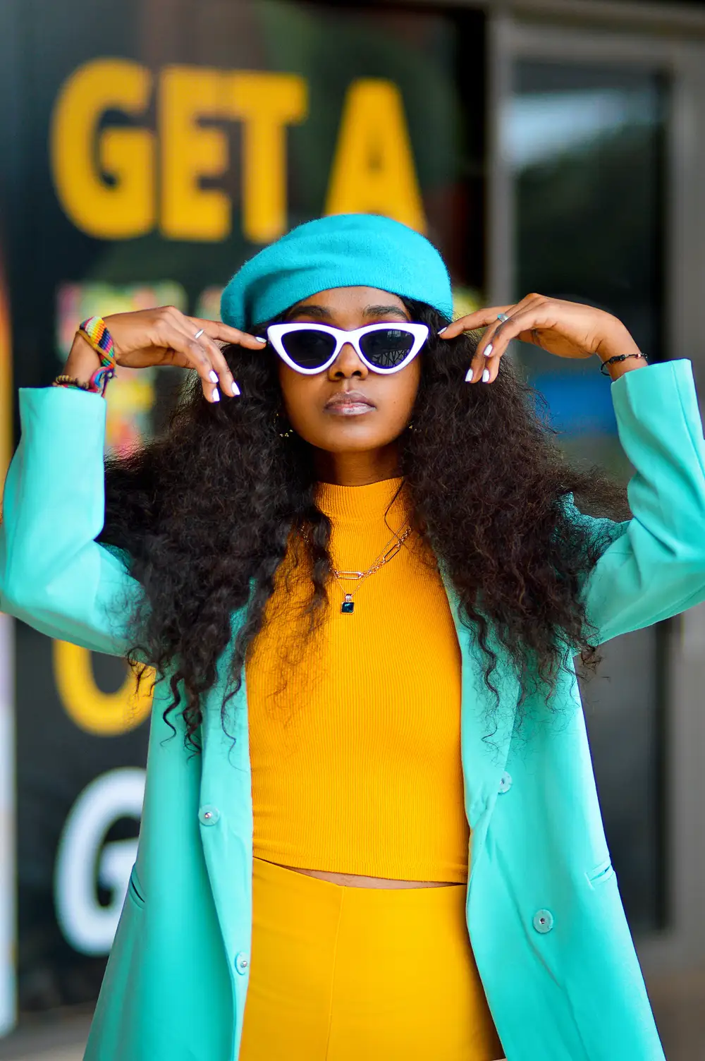 Stylish woman wearing coloured outfit.