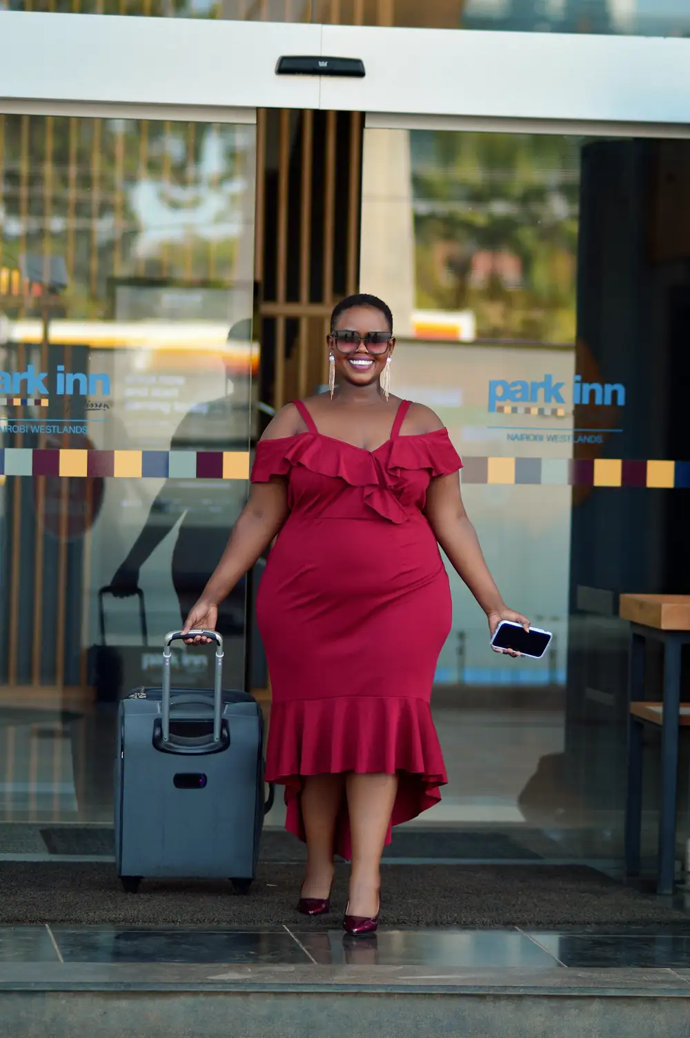 Woman walks out with her traveling bag