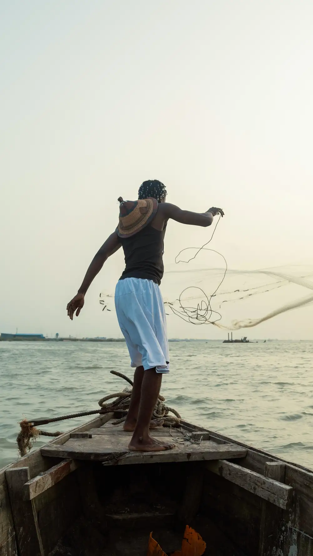 Man throwing fishing net