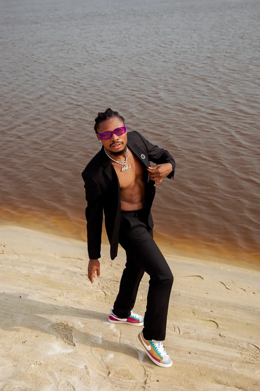 A Man in Black Suit on the Beach