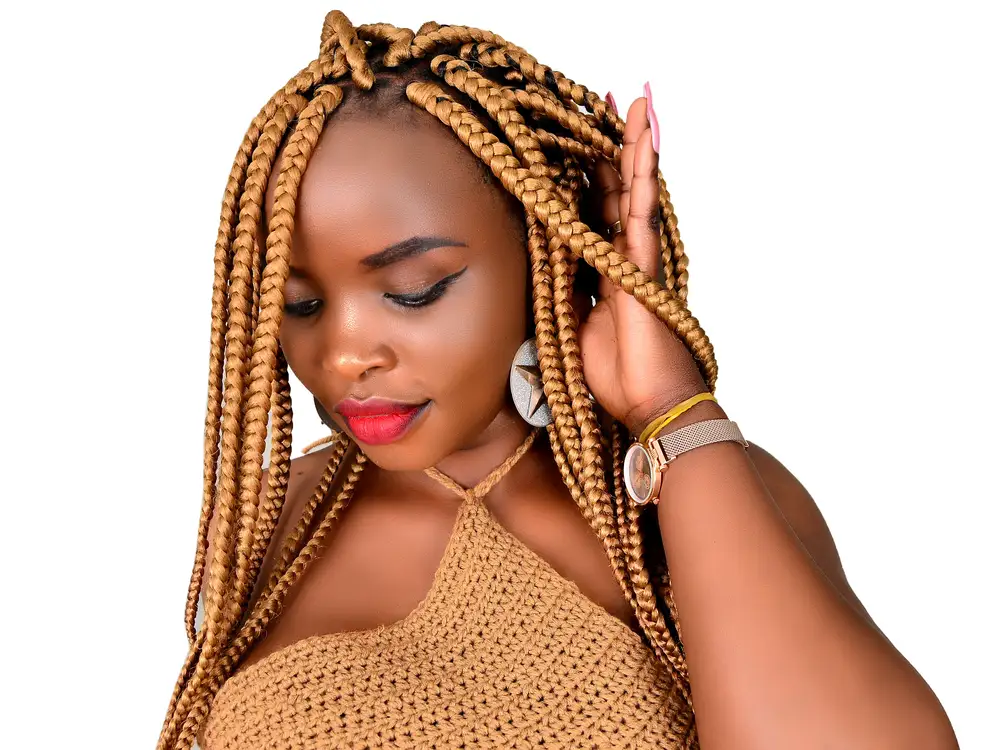 Woman with Blonde Braids Posing for Photo