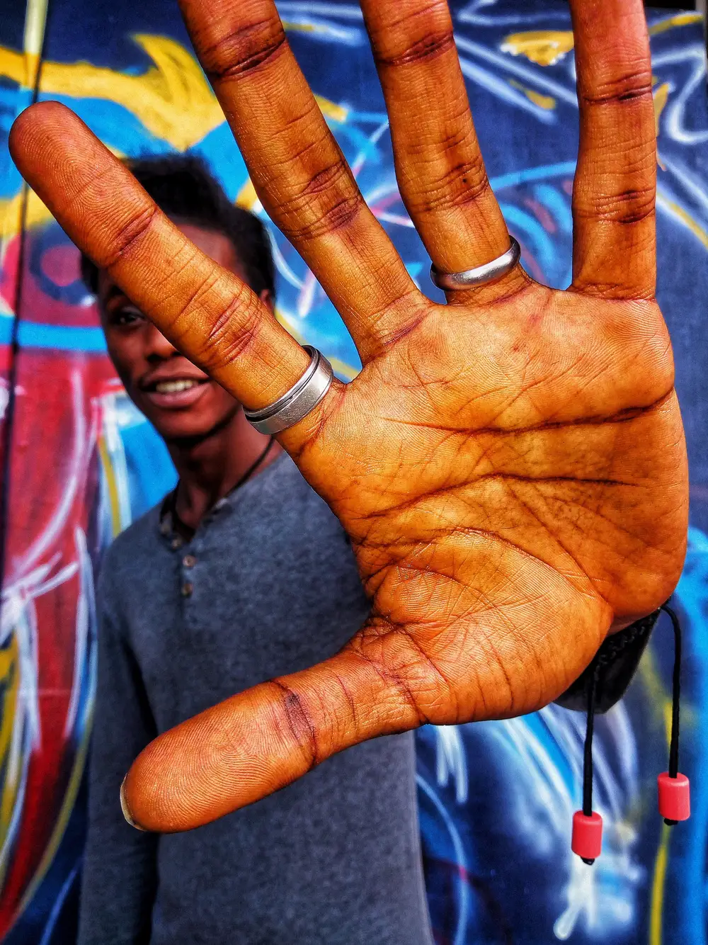 Black Man Stretching Hands Out