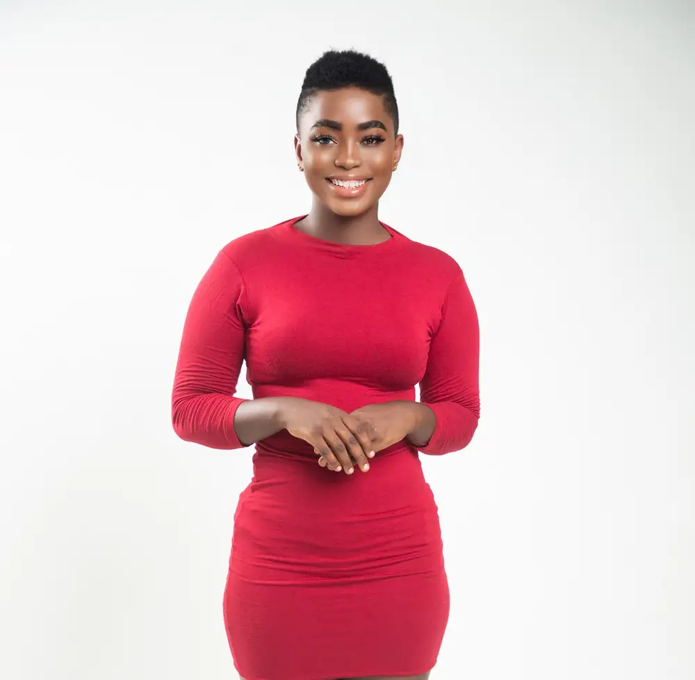 woman with short hair in red dress