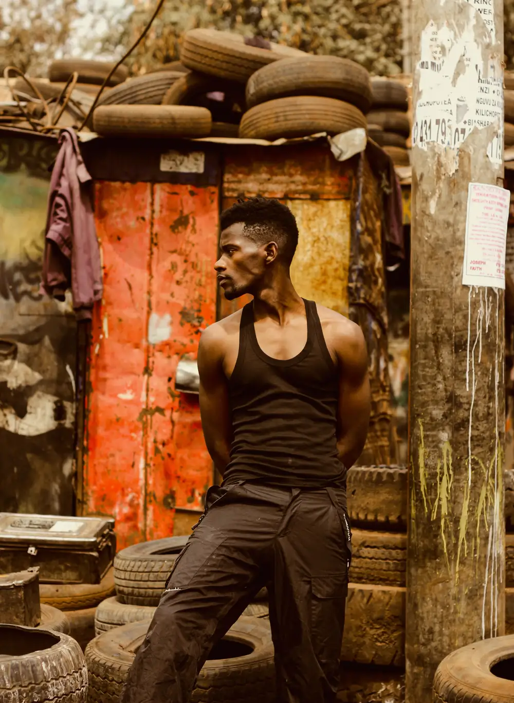 Black Man in Black Tank Top and Black Pants