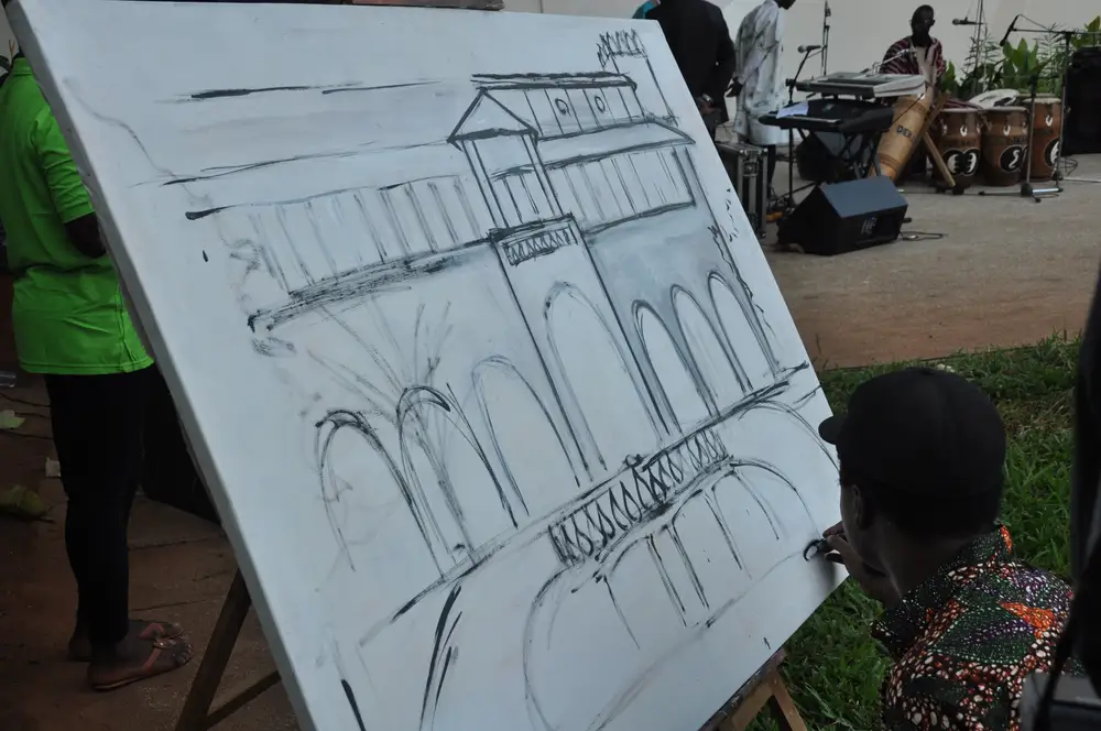 Man sketching a house
