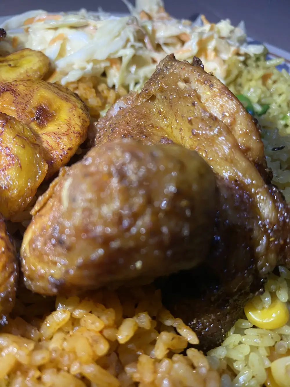 Fried chicken,plantain,fried rice and jollof