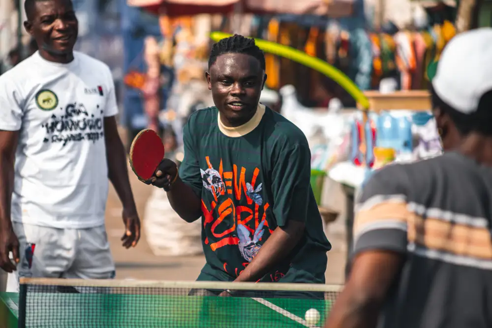 Young men playing tennis