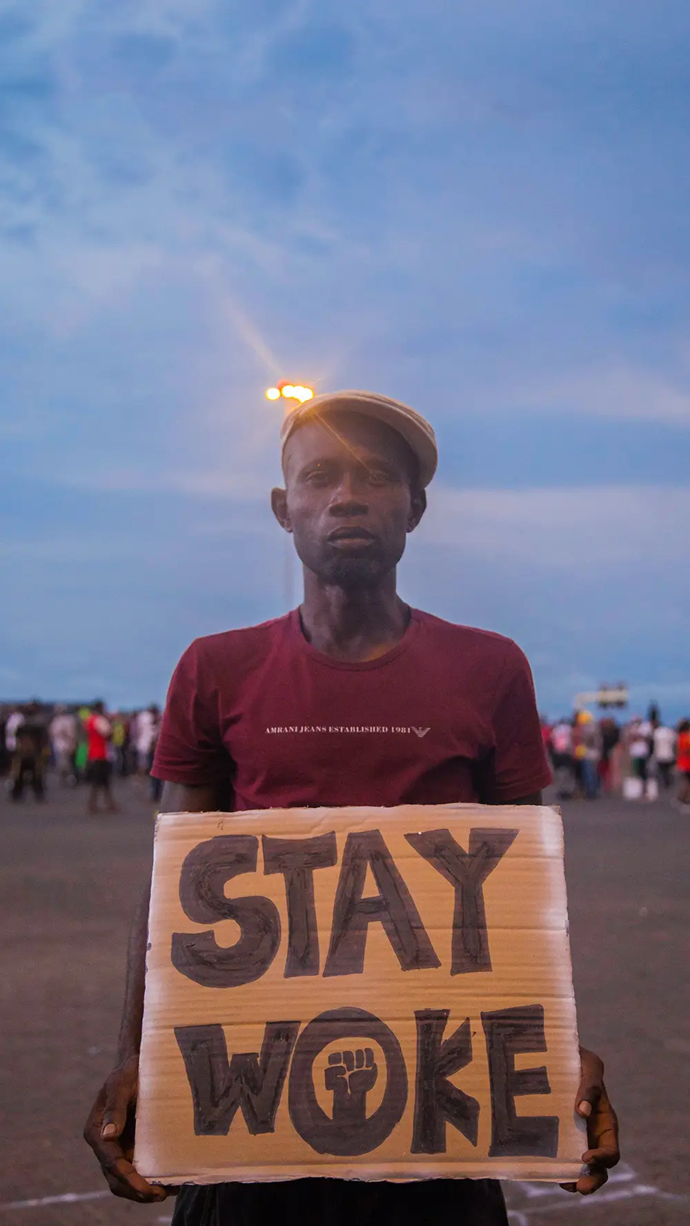 A man holding a placard
