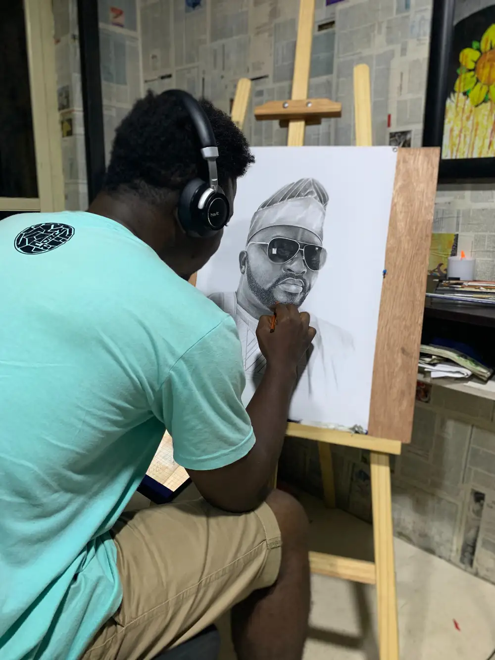 african man drawing a man