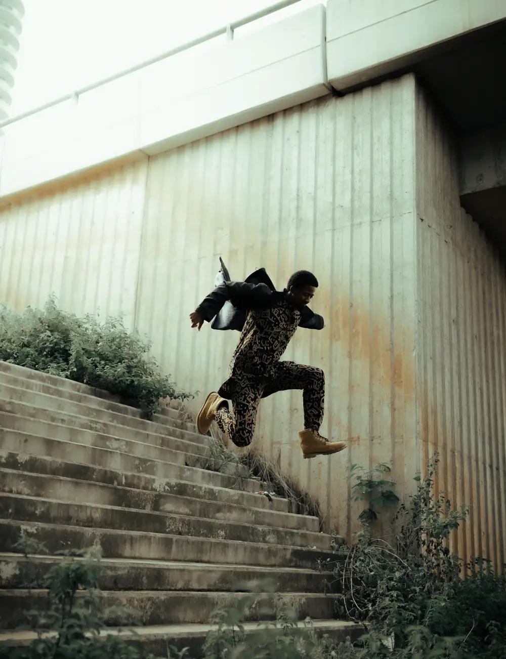 young man jumping over stairs