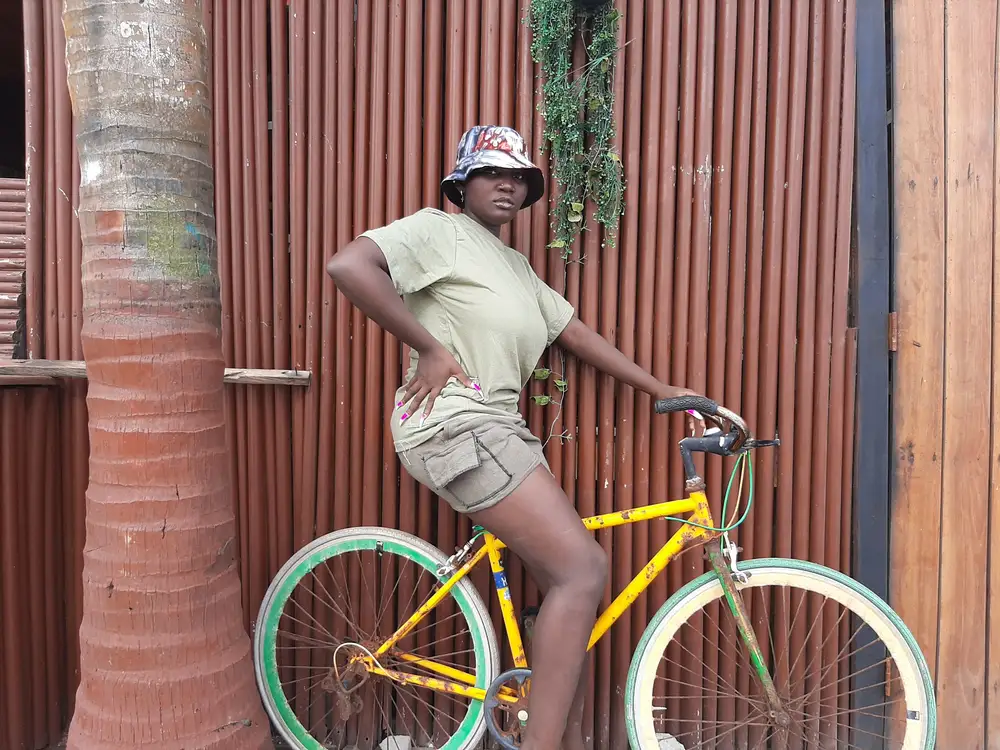 black woman on a bicycle