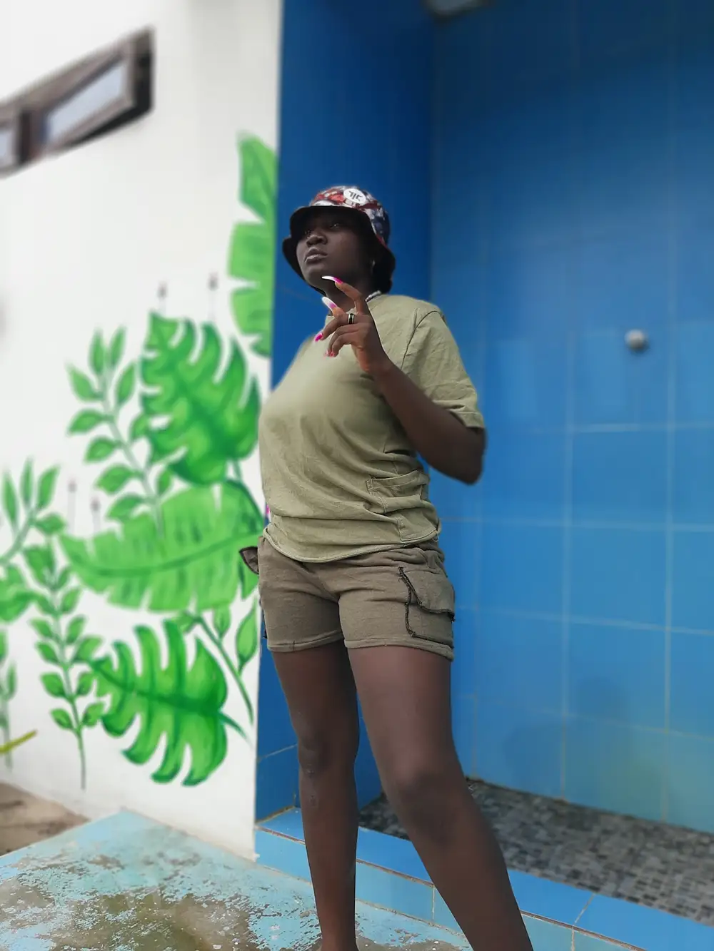 young lady on shorts and face cap