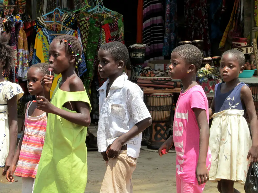 black children in a marketplace