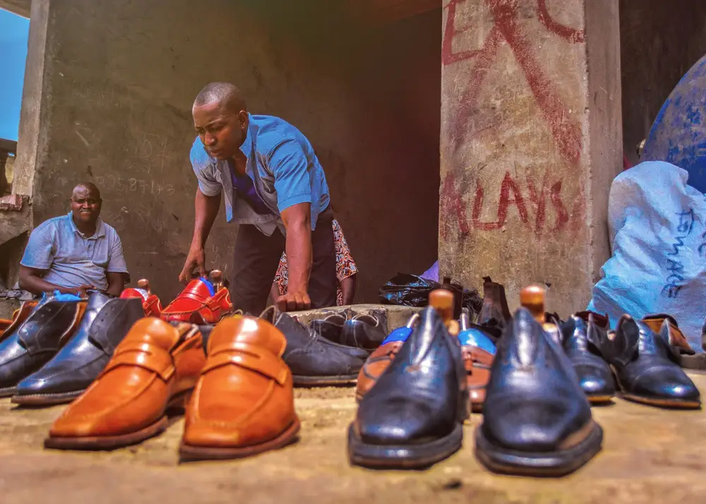 Used shoes vendors displaying their wares