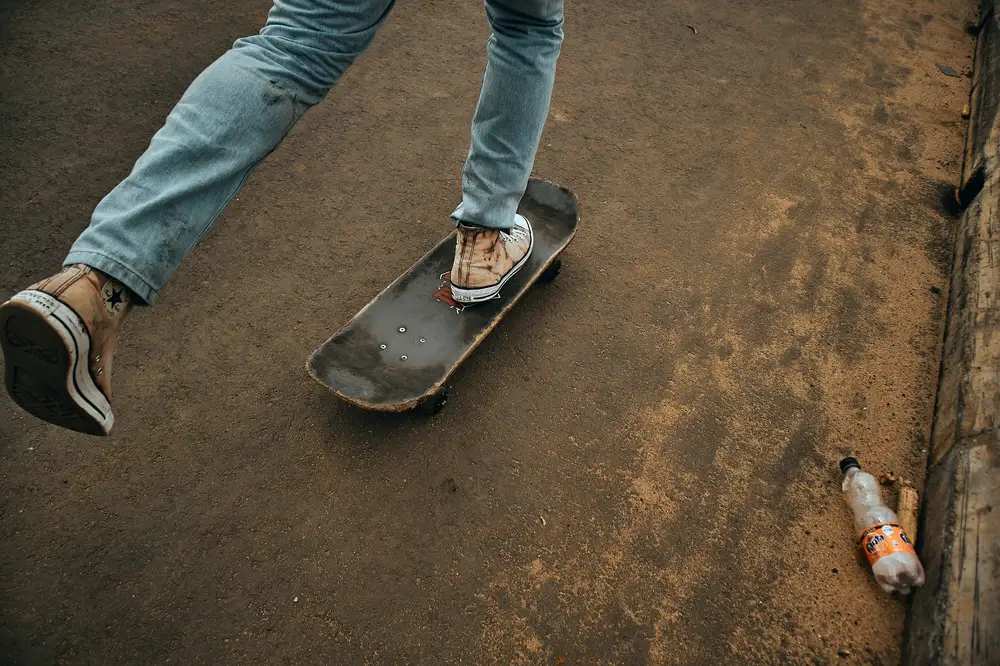 A picture of a young skateboarder skating around in the city of Port Harcourt.