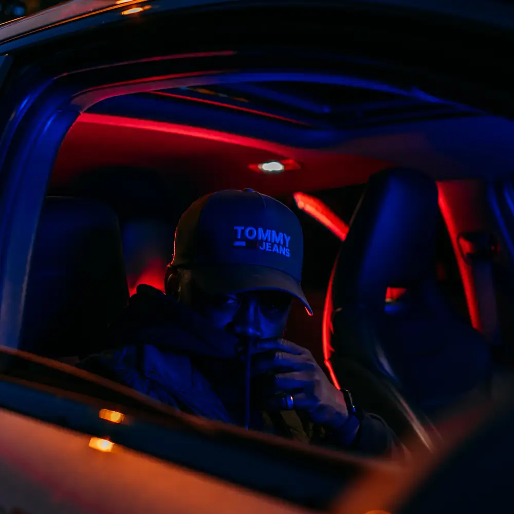 Man takes a photo in the car at night