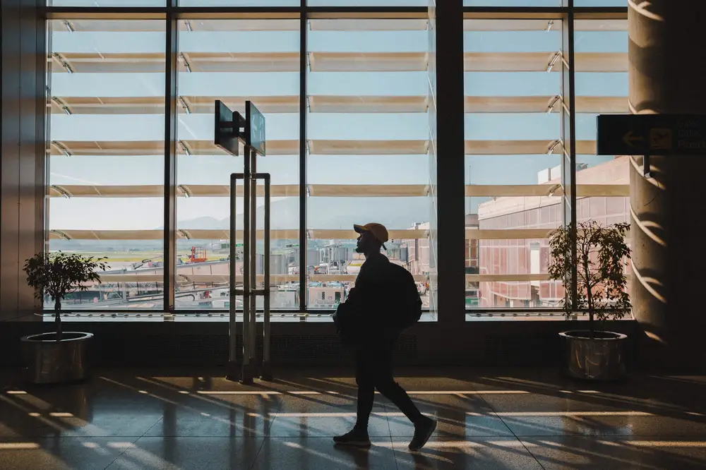 Man walking in an airport lobby hall