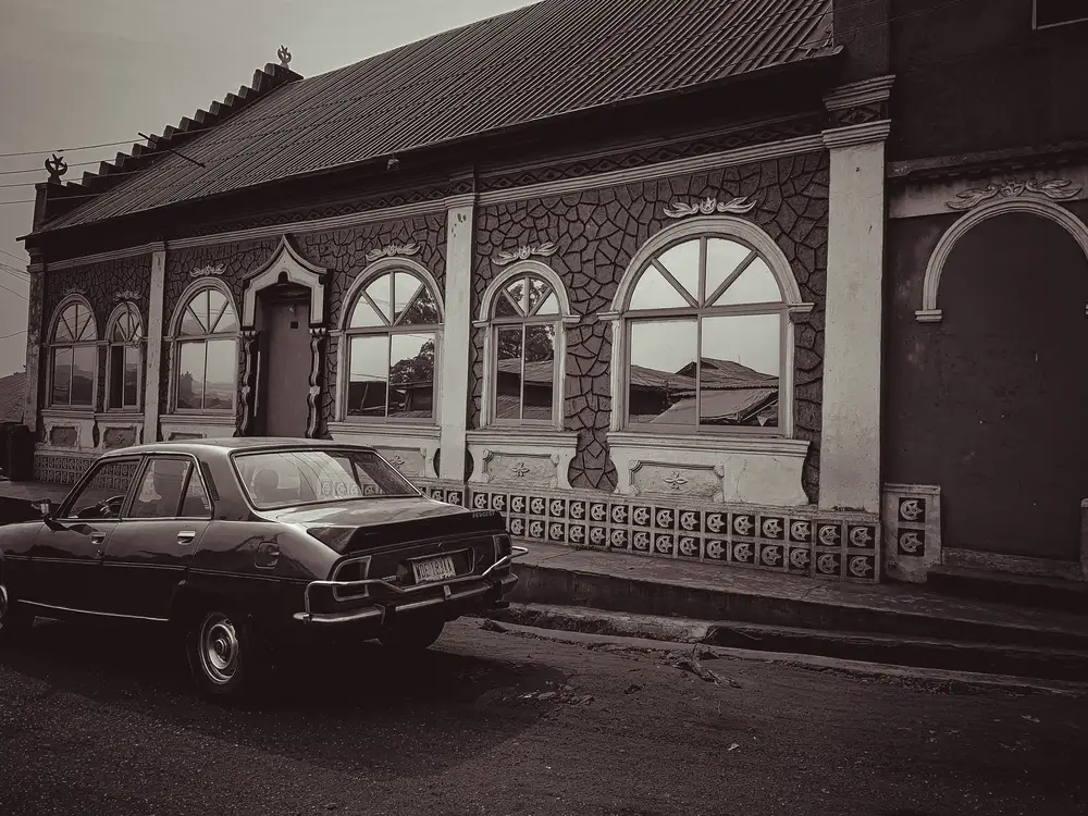 Historical traditional house and old vintage car
